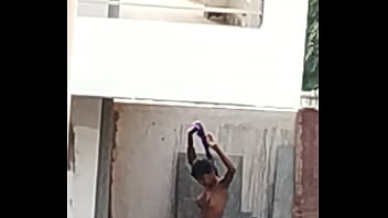 Indian lady bathing