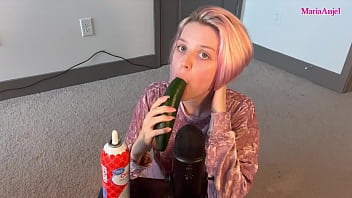 Girl deepthroats cucumber