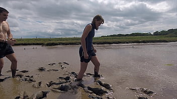 Naked women in mud